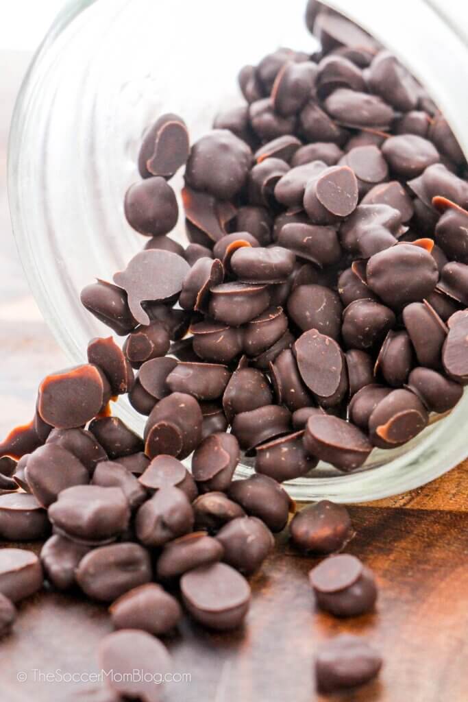 Close Up of Chocolate Covered Espresso Beans Spilling Out of a Jar