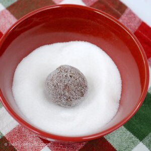 ball of cookie dough in granulated sugar