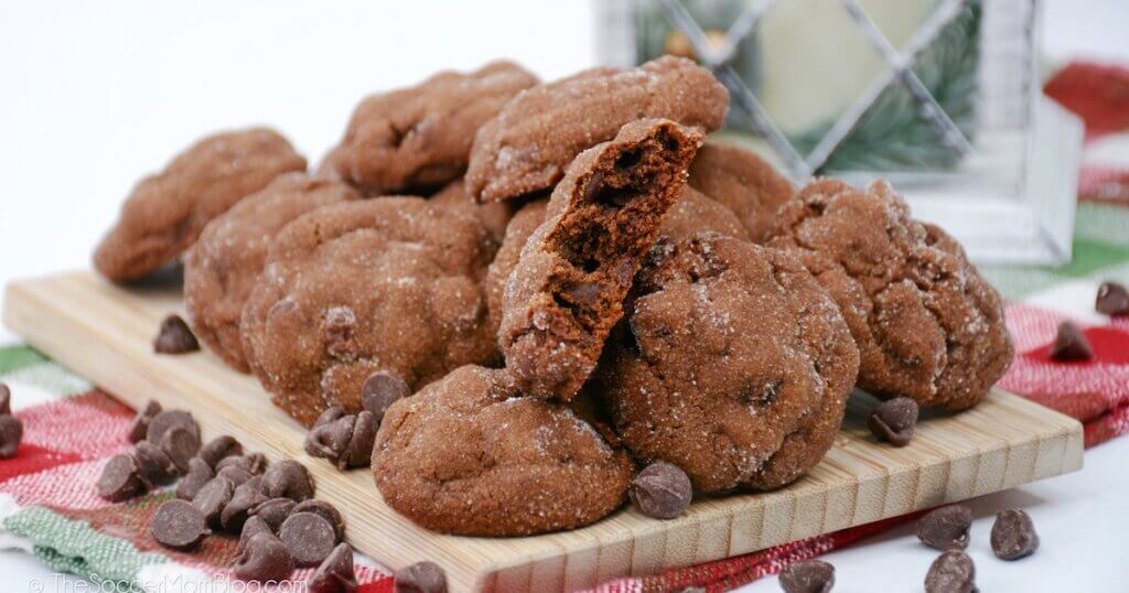 pile of chocolate gingerbread cookies on cutting board