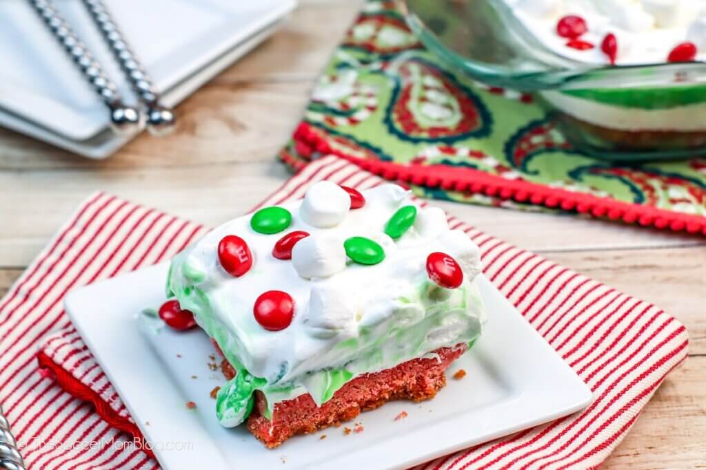 slice of Christmas Lasagna dessert on a decorated table
