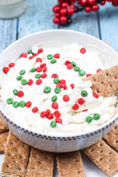 homemade Christmas cookie dip with sprinkles and graham crackers for dipping