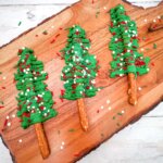 pretzel rods decorated to look like Christmas trees