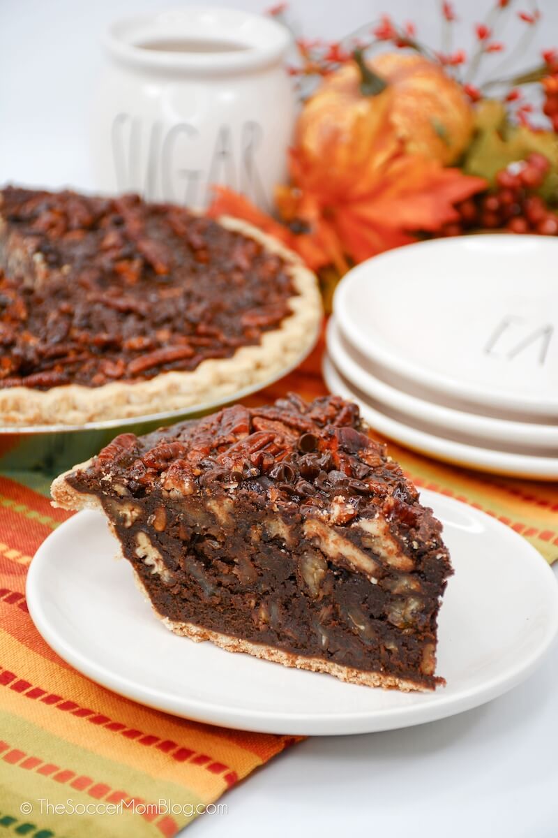 slice of fudge pie filled with and topped with pecans
