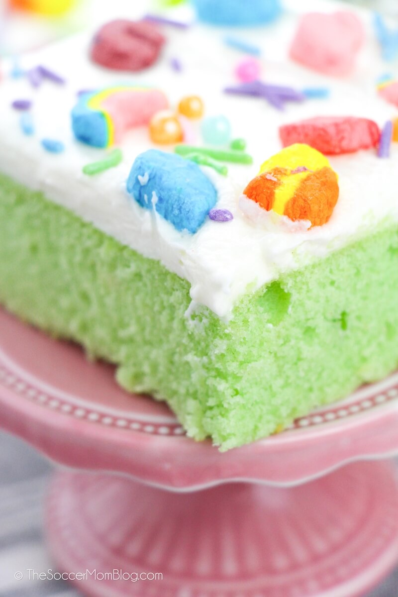 close up of a slice of green Lucky Charms cereal cake