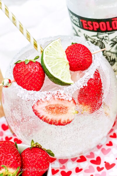 sparkling tequila cocktail with strawberries and lime