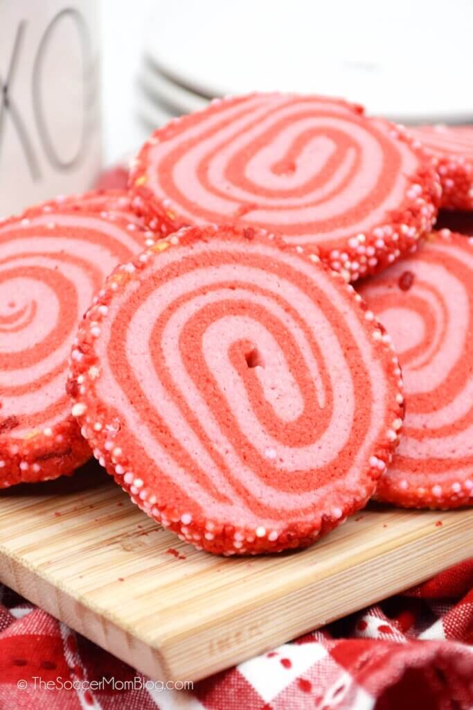 A pile of Valentine Pinwheel Cookies, red and white swirled sugar cookies