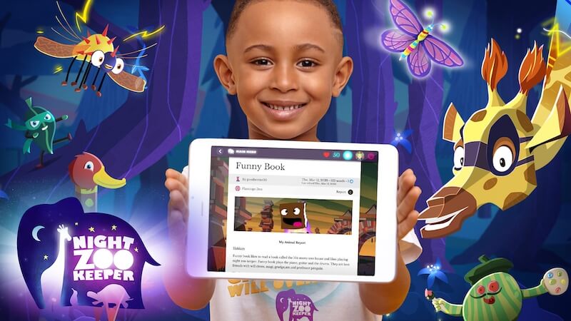 little boy holding up tablet with Night Zookeeper writing app