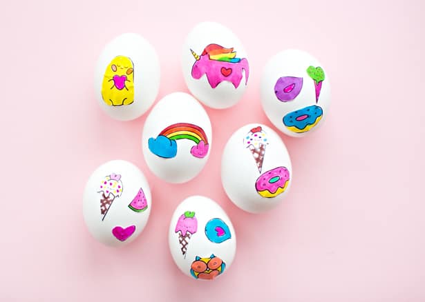 white eggs with colorful stickers