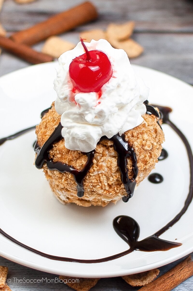 scoop of homemade fried ice cream with whipped cream and chocolate