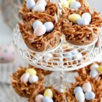 tiered tray of "birds nest cookies" haystack cookies for Easter with candy eggs