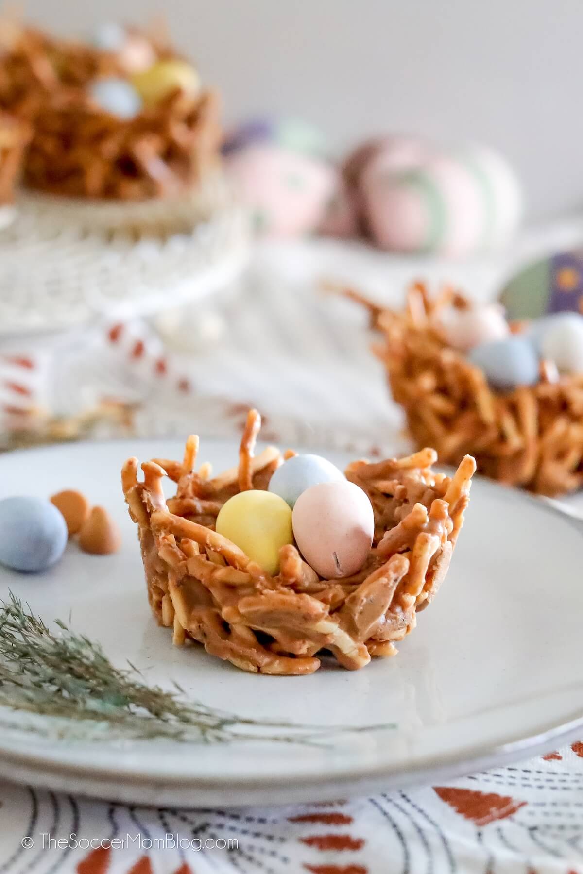 haystack cookie shaped like a birds nest and topped with candy eggs