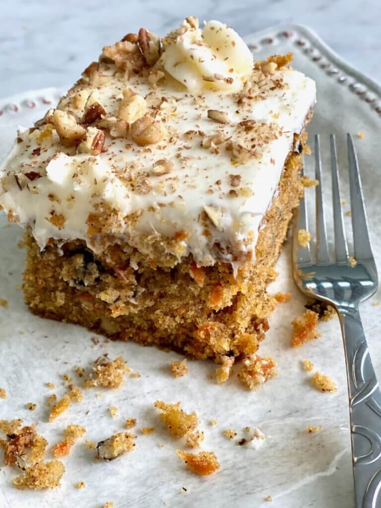 square of carrot cake sheet cake with nuts