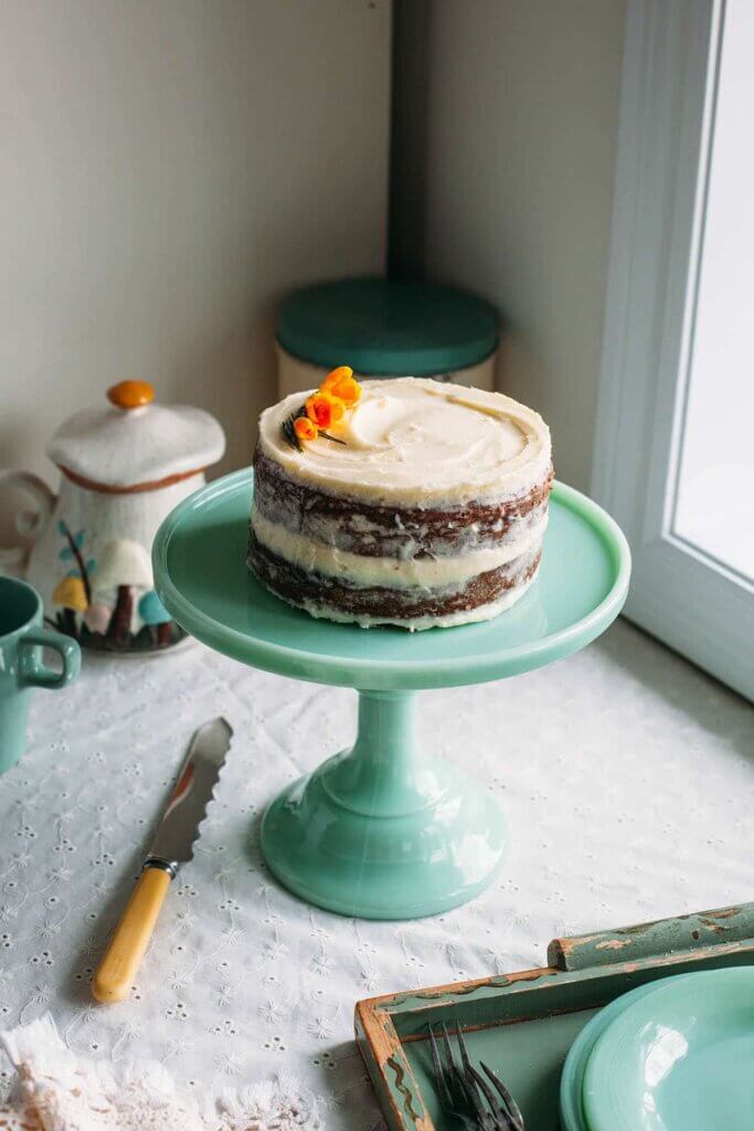 layered carrot cake on cake stand