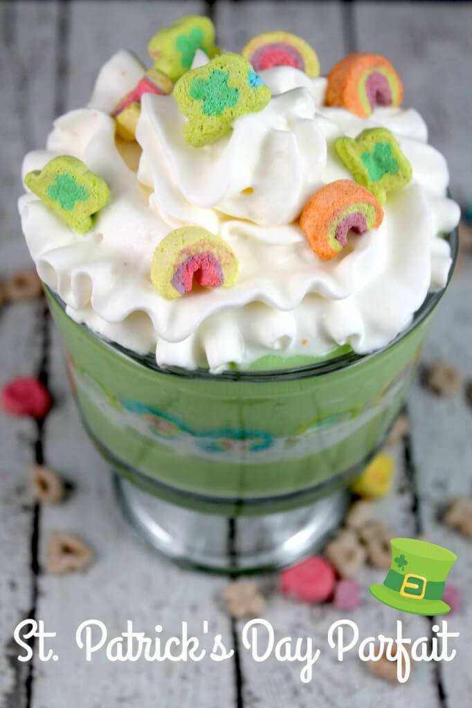 green parfait topped with whipped cream and Lucky Charms marshmallows