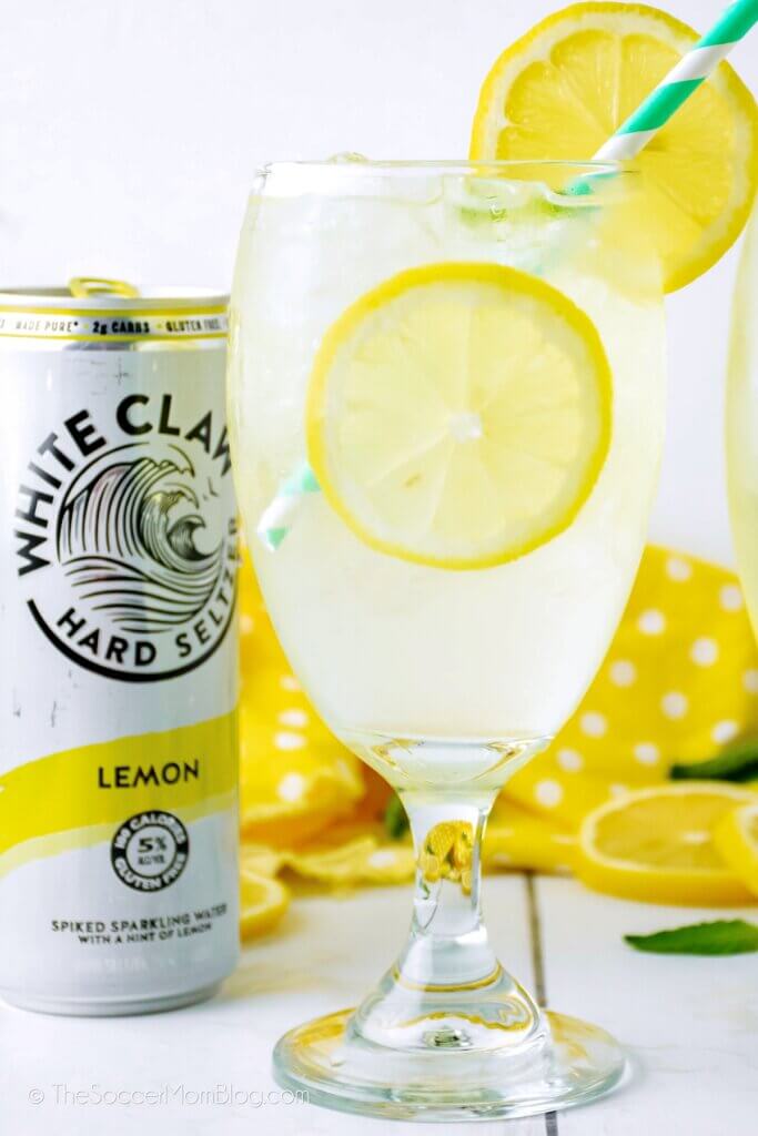 sparkling lemonade cocktail next to a can of White Claw seltzer