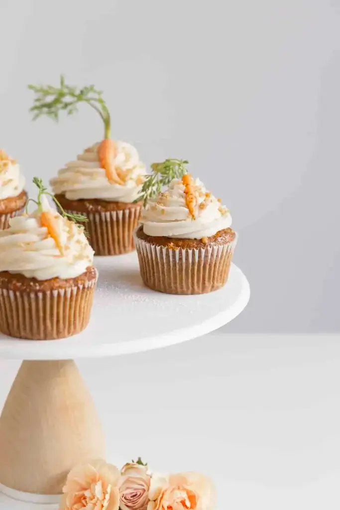fancy decorated carrot cake cupcakes with real mini carrots on top