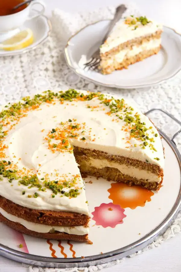 carrot cake with cream cheese icing and almonds