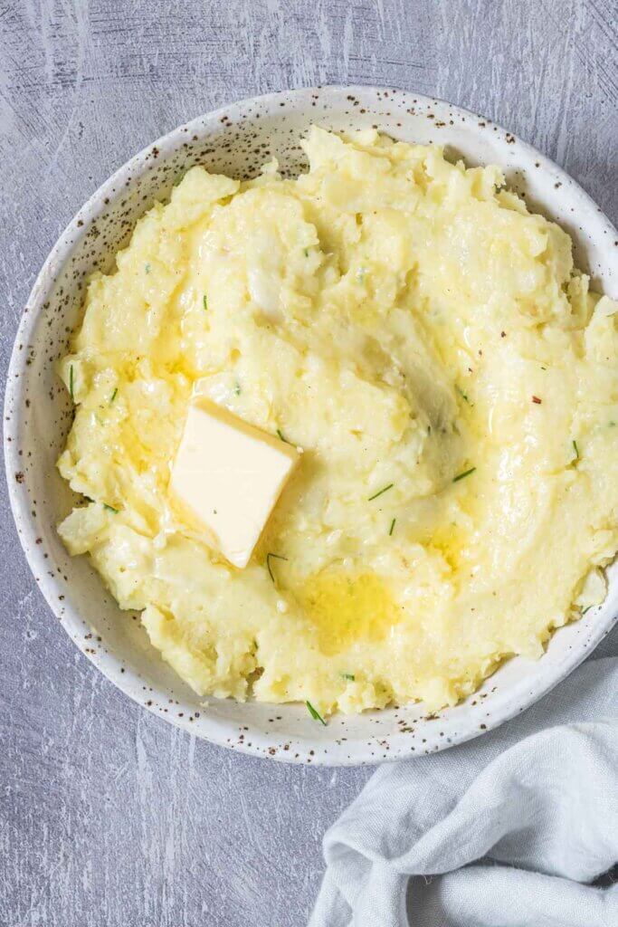 mashed potato colcannon in bowl with butter