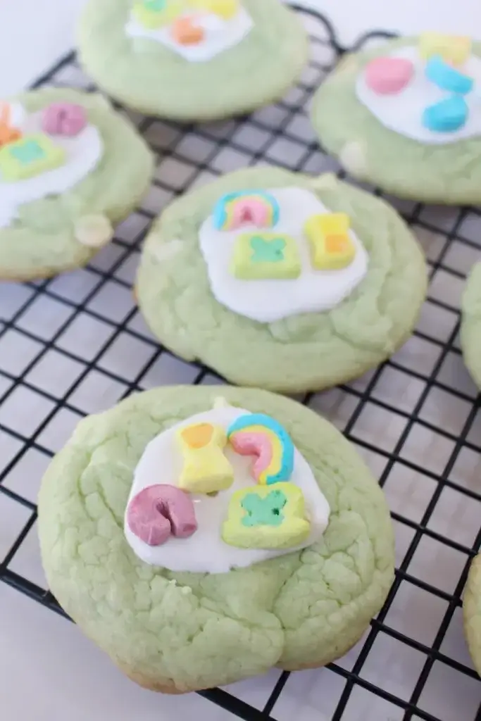 light green cookies topped with Lucky Charms marshmallows
