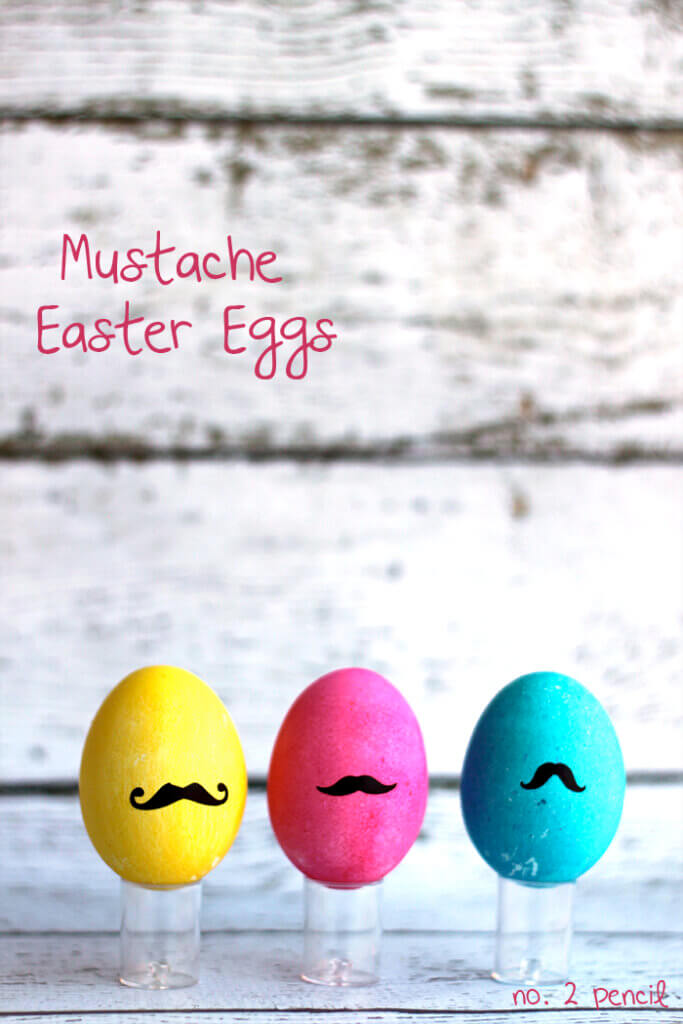 dyed eggs with black mustache drawings