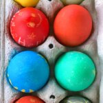 carton of brightly dyed Easter eggs