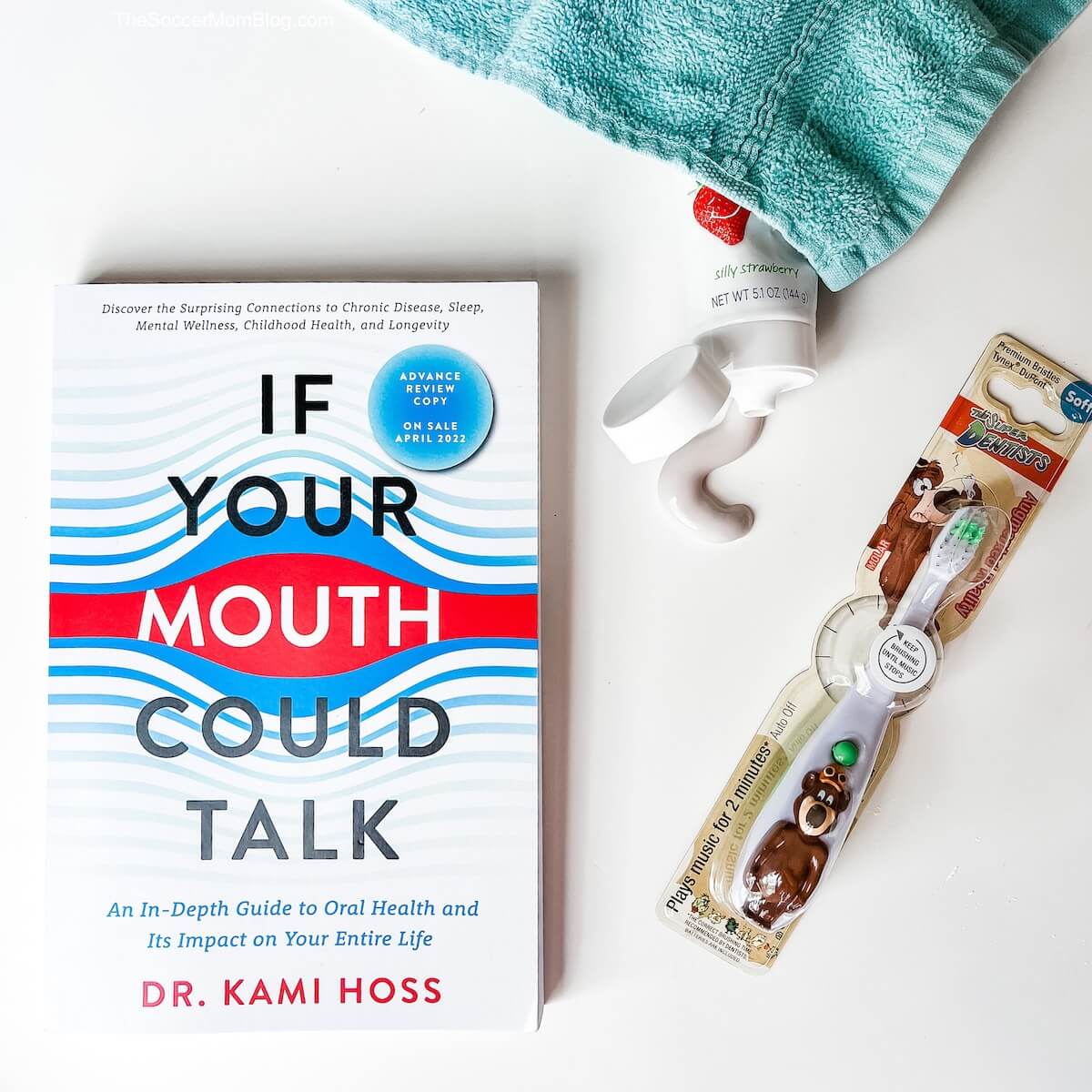 flat-lay of book "If Your Mouth Could Talk" and toothbrush