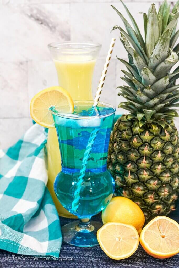 Smurfette Cocktail with lemons and a pineapple