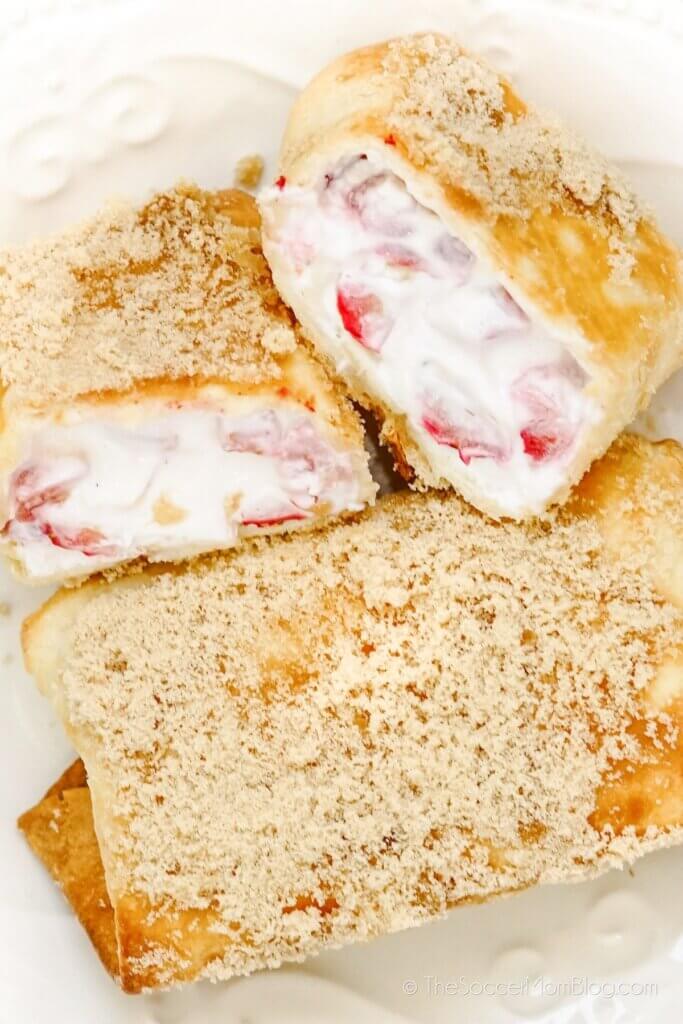 Completed Air Fryer Strawberry Chimichangas, with cheesecake filling, cut in half
