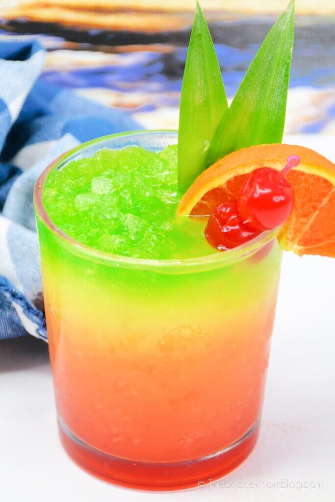 layered tropical drink, red orange and green