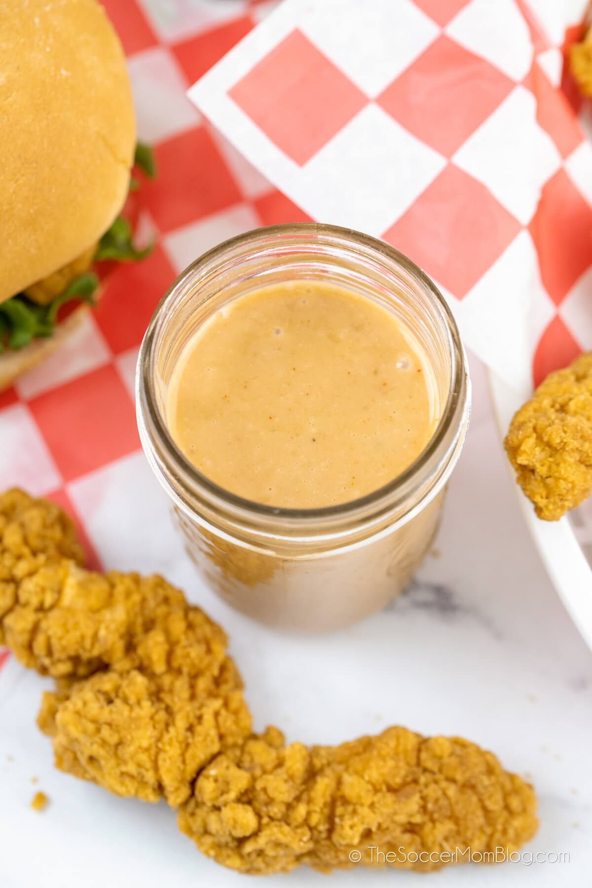 jar of homemade Chick-Fil-A sauce with chicken tenders