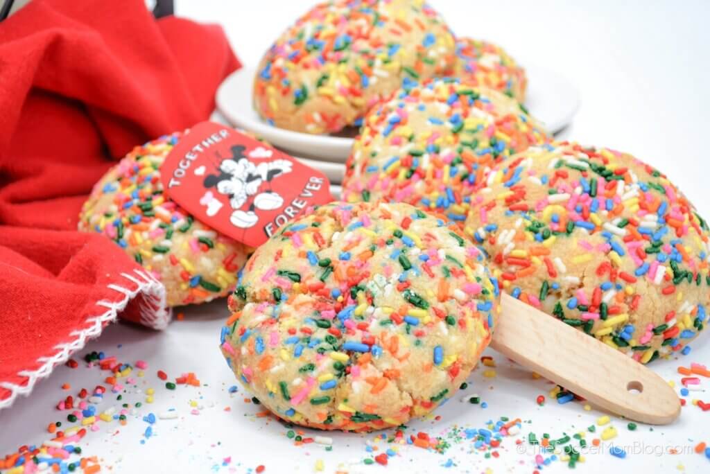 A pile of Sprinkle Funfetti Cookies with spatula