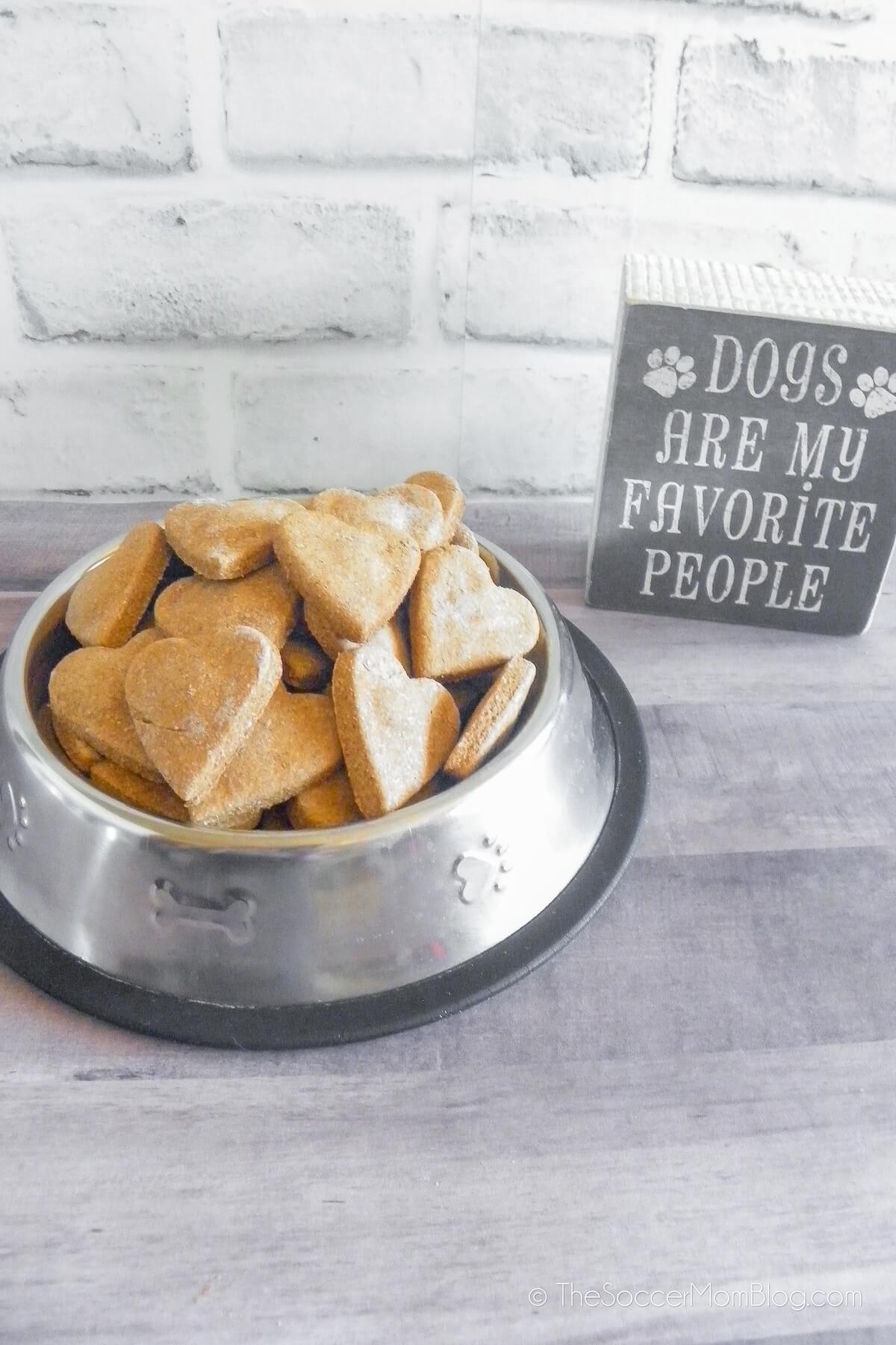 bowl of homemade dog biscuits and a decorative sign