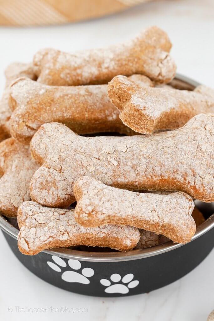close up of a bowl of bone-shaped dog biscuits