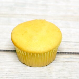 unfrosted yellow cupcake