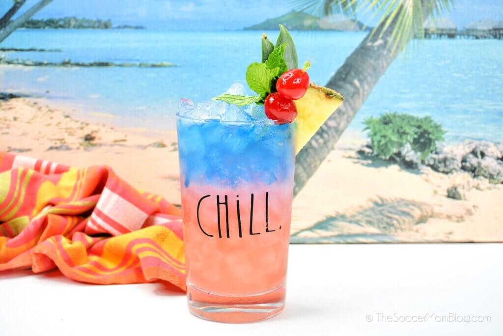 Blue Hawaiian drink on a beach backdrop