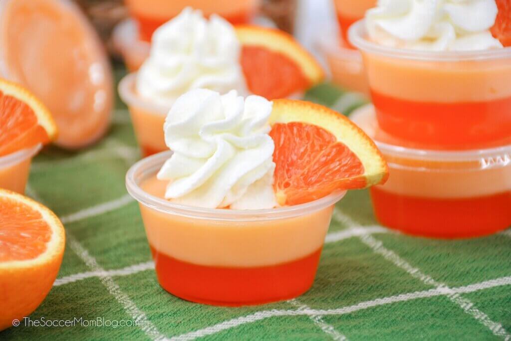 Fully Prepared Creamsicle Jello Shots, with two orange layers