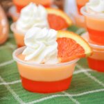 creamsicle orange jello shots with whipped cream and orange slices