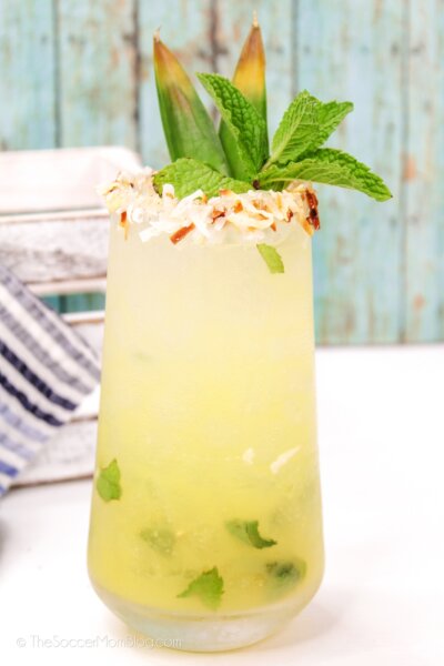 Pineapple Mojito in a glass with toasted coconut rim