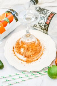 dipping glass into chili lime seasoning