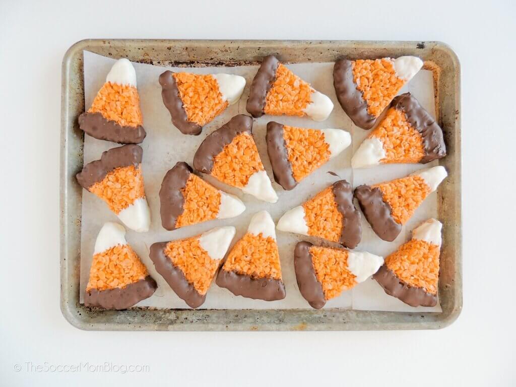 Candy Corn Rice Krispies cooling on a sheet pan