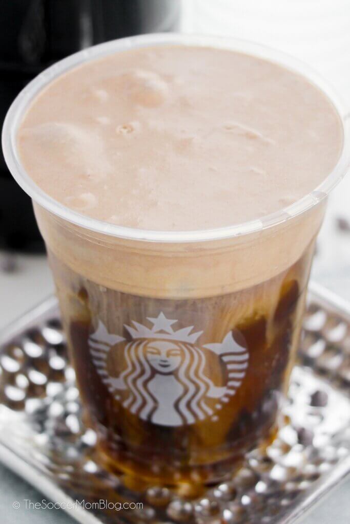 cold brew coffee with foam, in a Starbucks cup
