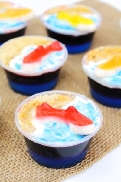 blue jello shots topped with gummy sharks