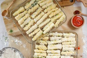 Air Fryer Zucchini Fries on cooking trays