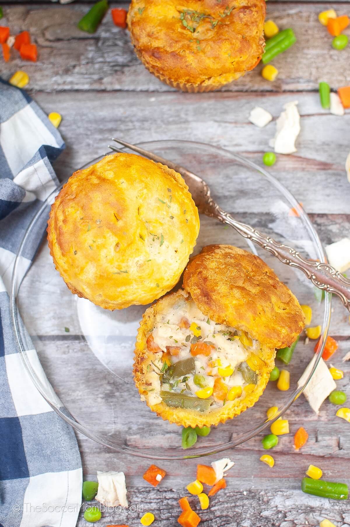 two mini chicken pot pies, surrounded by veggies