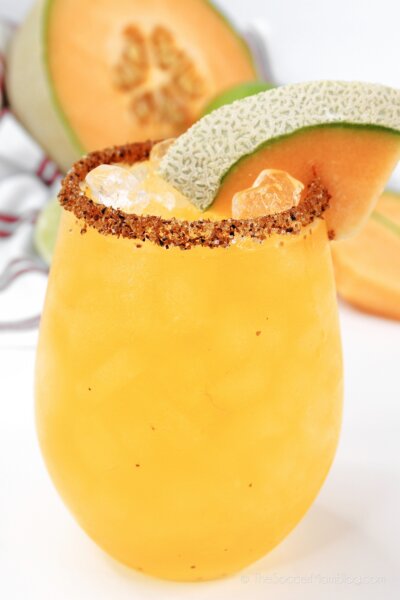 A full glass of Cantaloupe Margarita with a salted rim