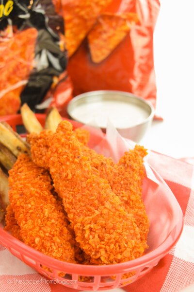 Doritos Chicken Tenders in a fast food basket, bag of chips in background