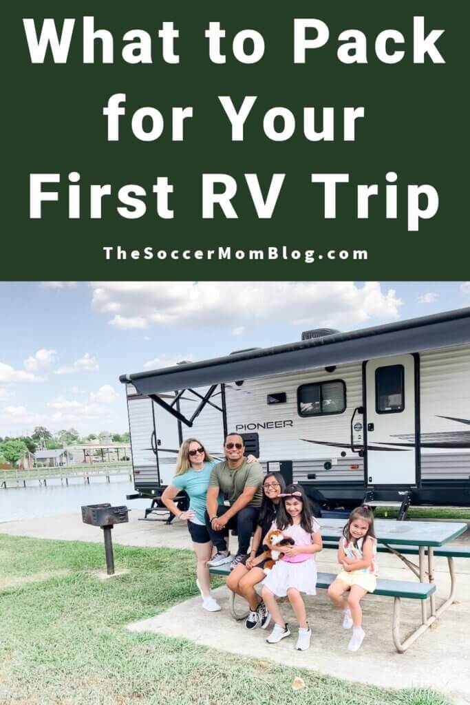family sitting in front of an RV; text overlay "What to Pack for Your First RV Trip"