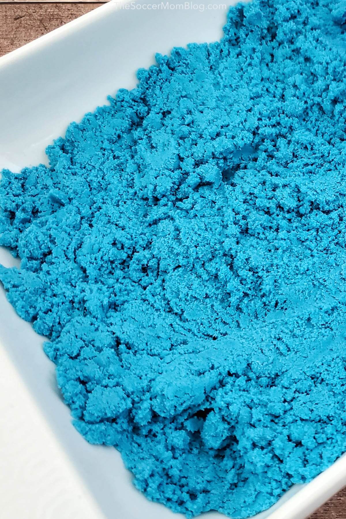 tray of bright blue homemade kinetic sand