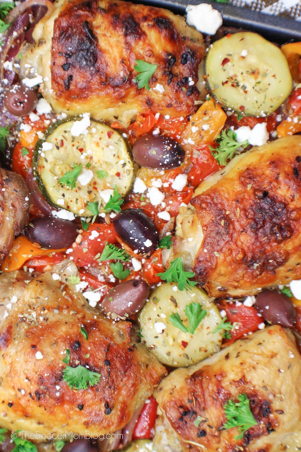 close up of Greek chicken in a sheet pan
