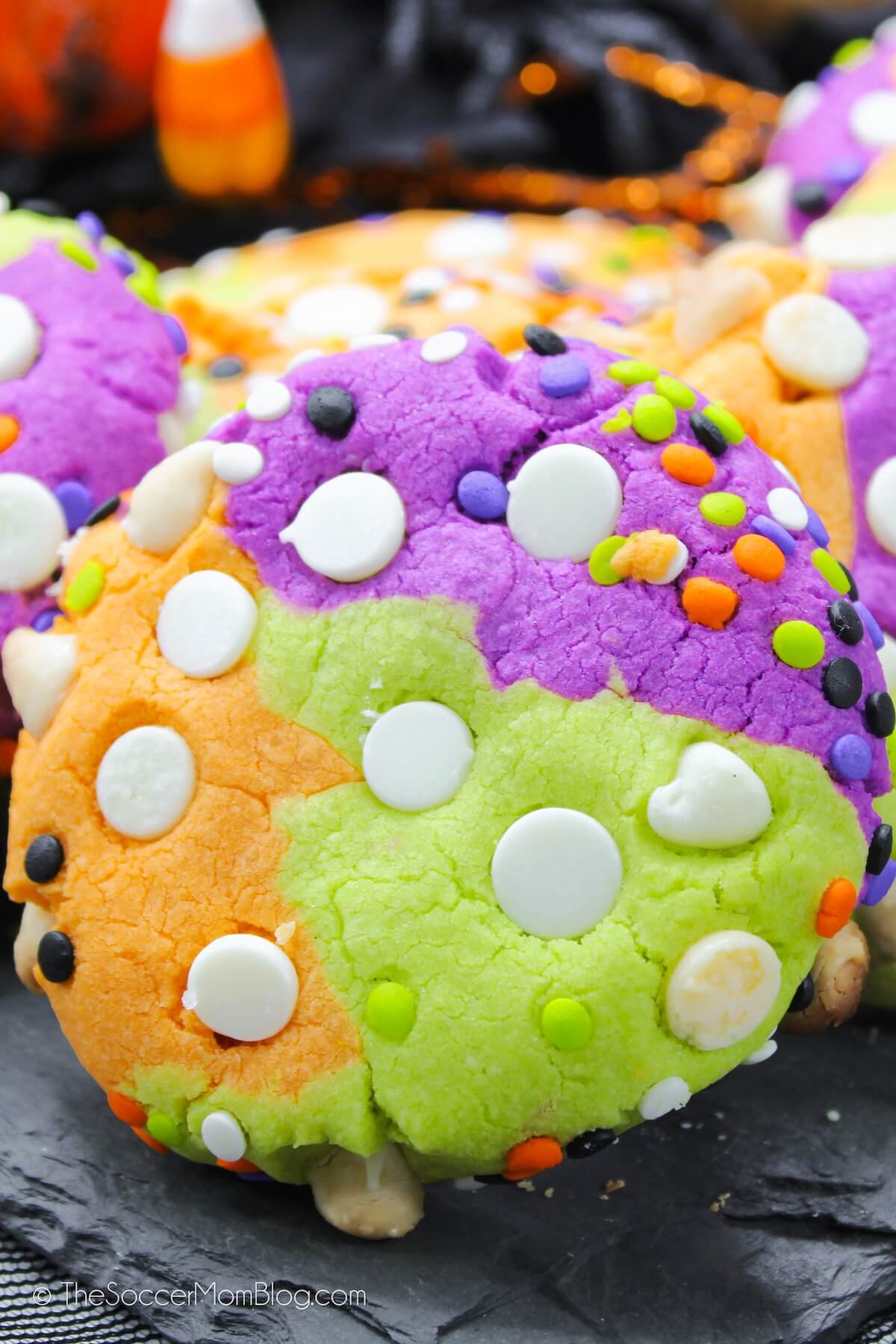 orange, green, and purple cookies with Halloween sprinkles